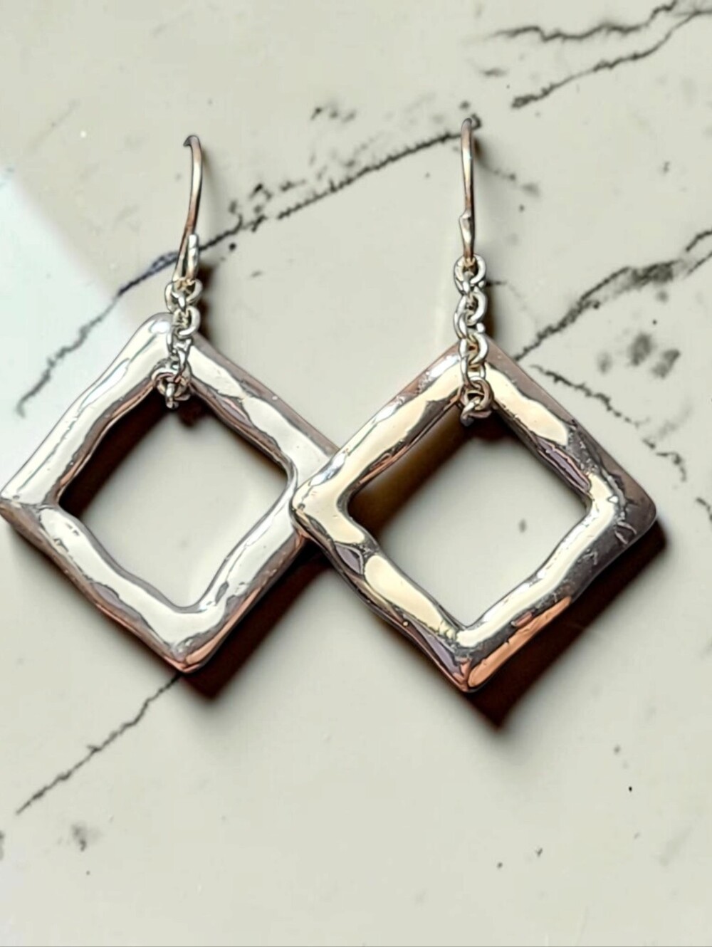 Handmade, un-hallmarked sterling silver earrings